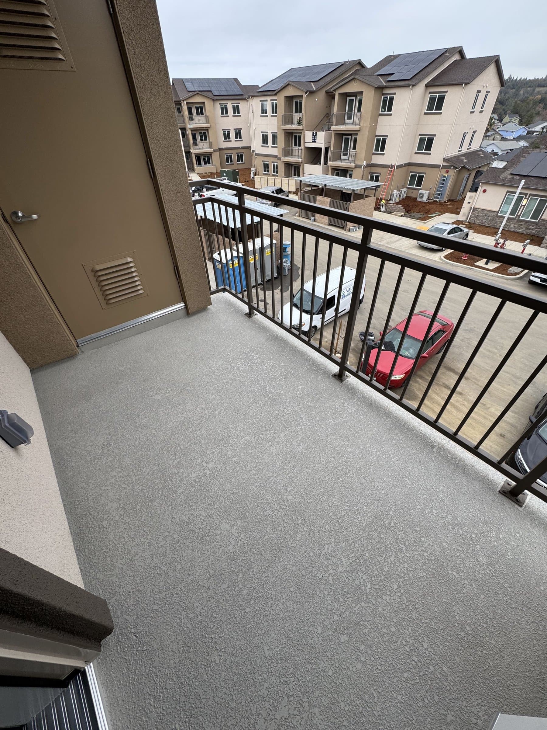 Finished balcony deck with waterproof coating