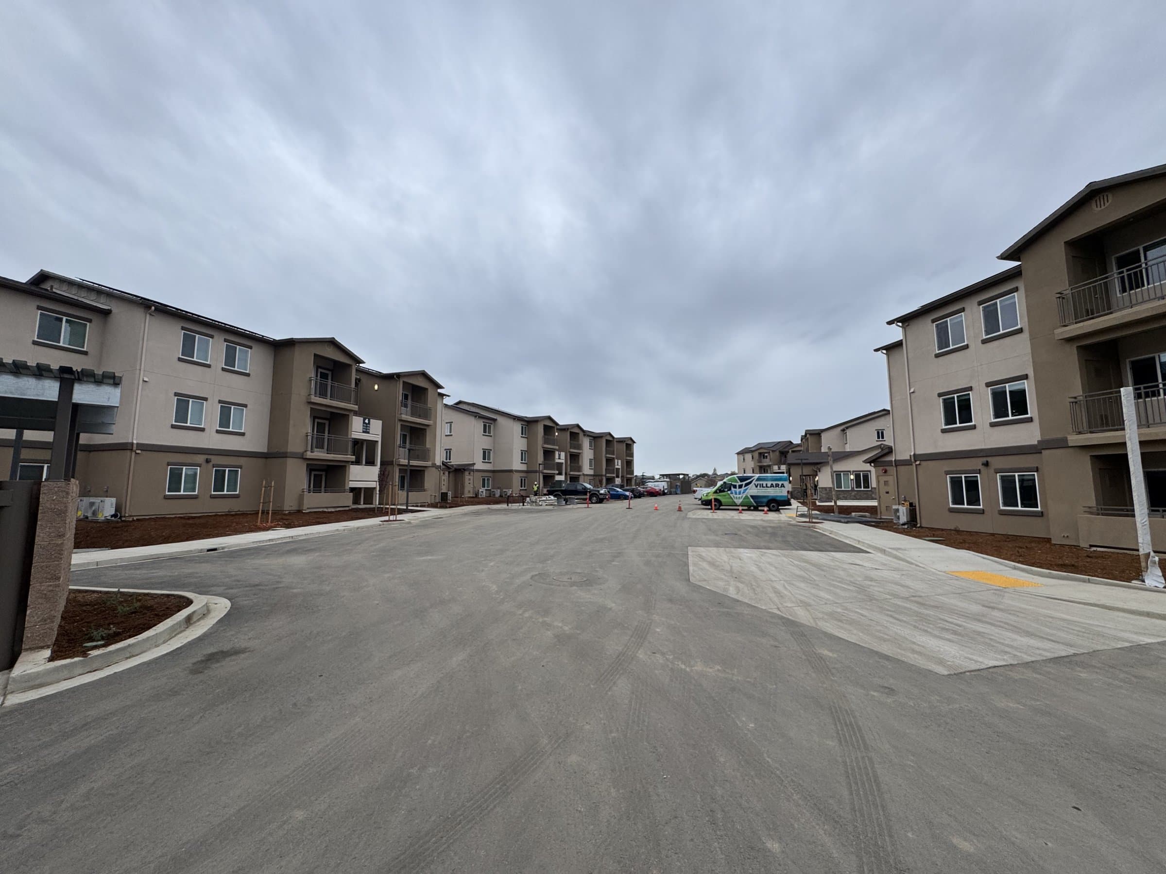 Site concrete between buildings at Mallard Apartments