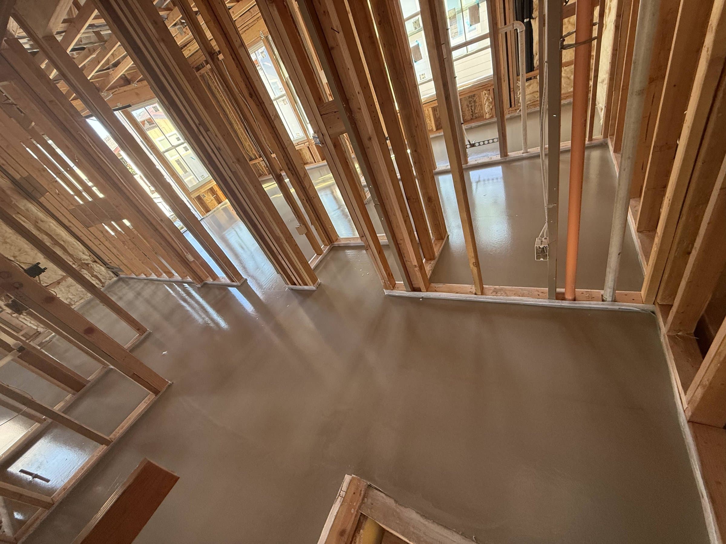Gypsum concrete underlayment in a framed apartment unit