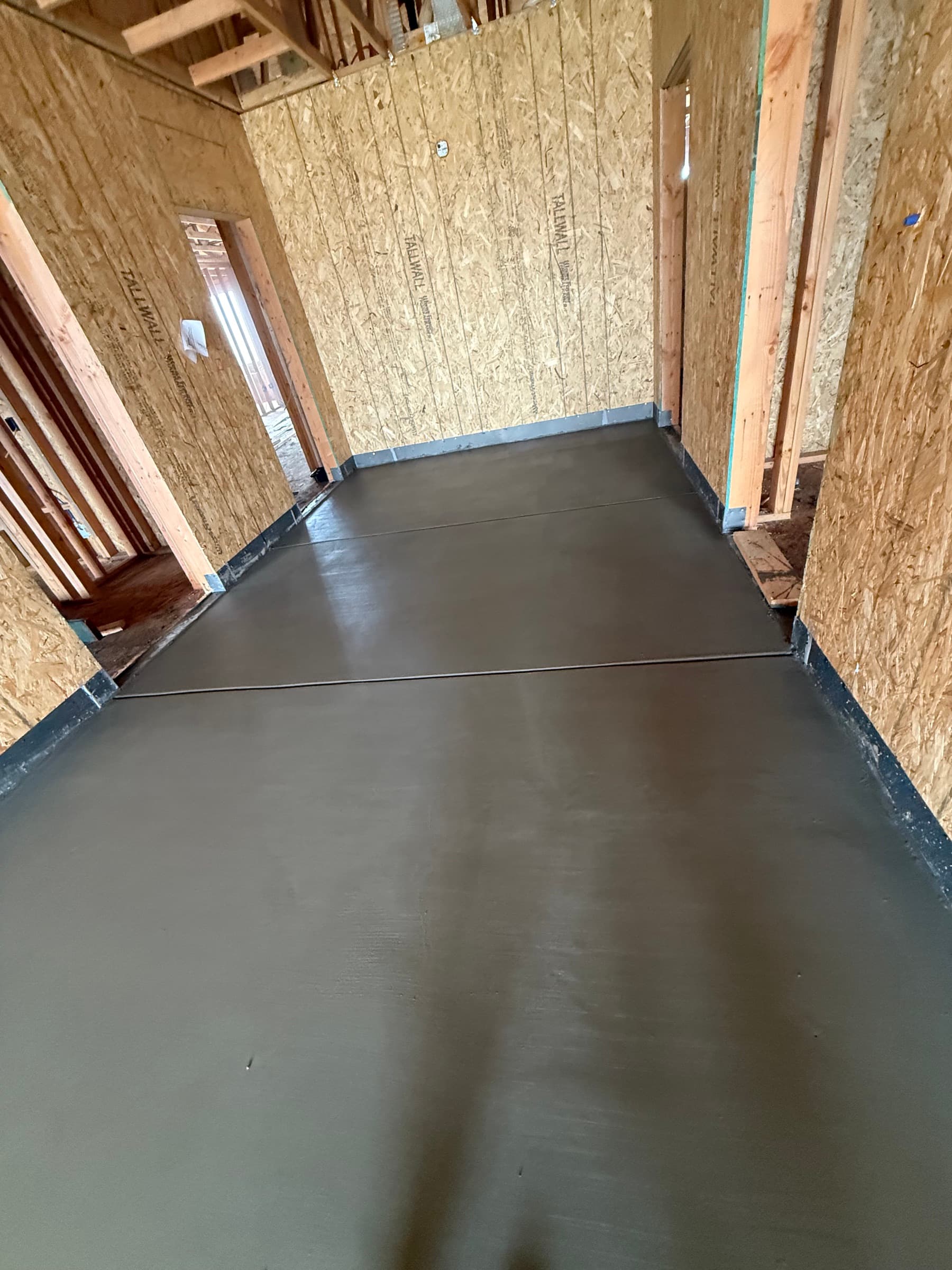 Gypsum concrete underlayment in a hallway